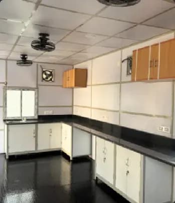 Cabin pantry and kitchen interior with counter and overhead storage